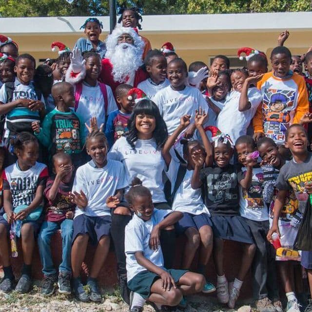 Karen Civil, Lil Wayne, & Andre Berto Spread Holiday Cheer in Haiti